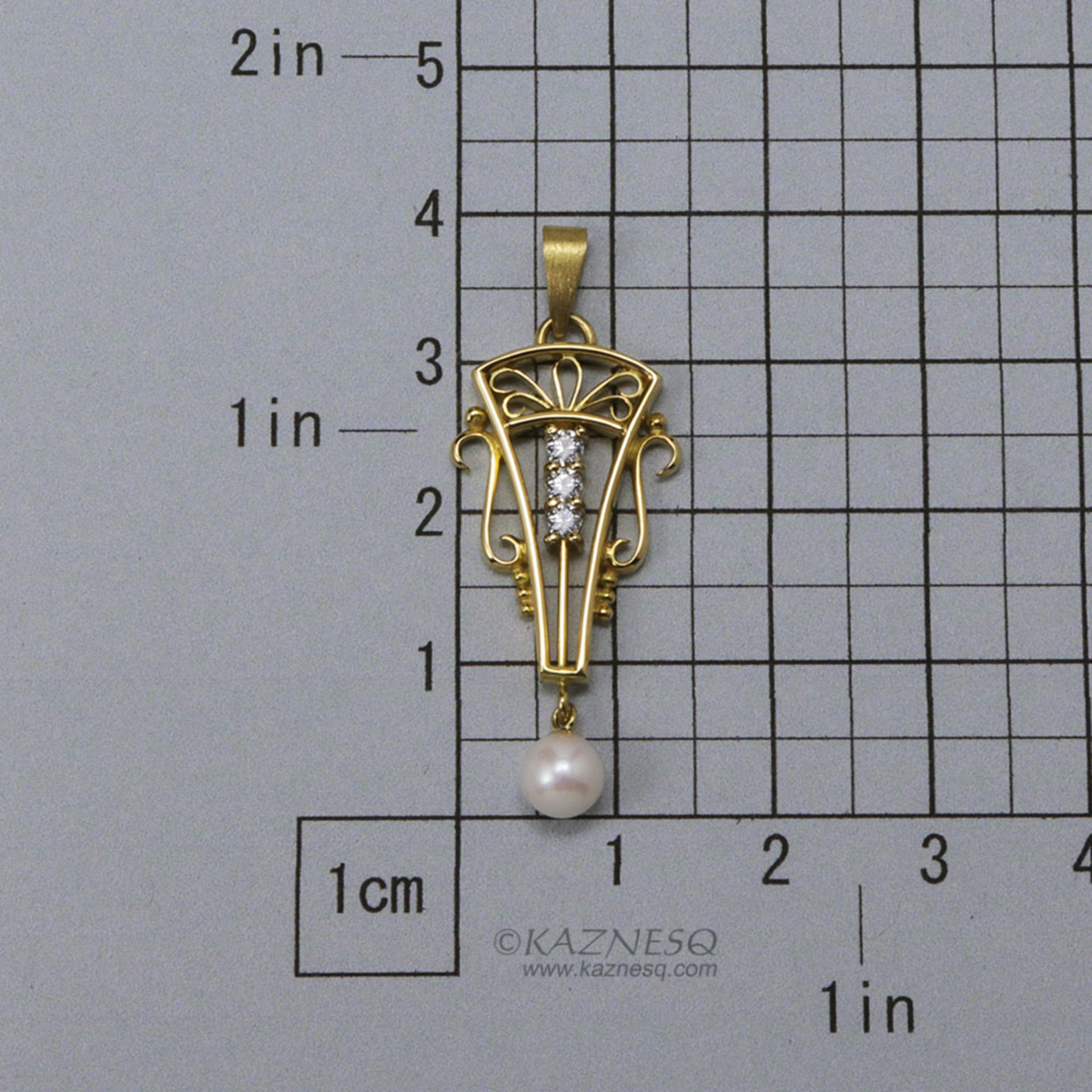 Art Deco style 18K gold, diamond, cultured pearl pendant head of arch motif