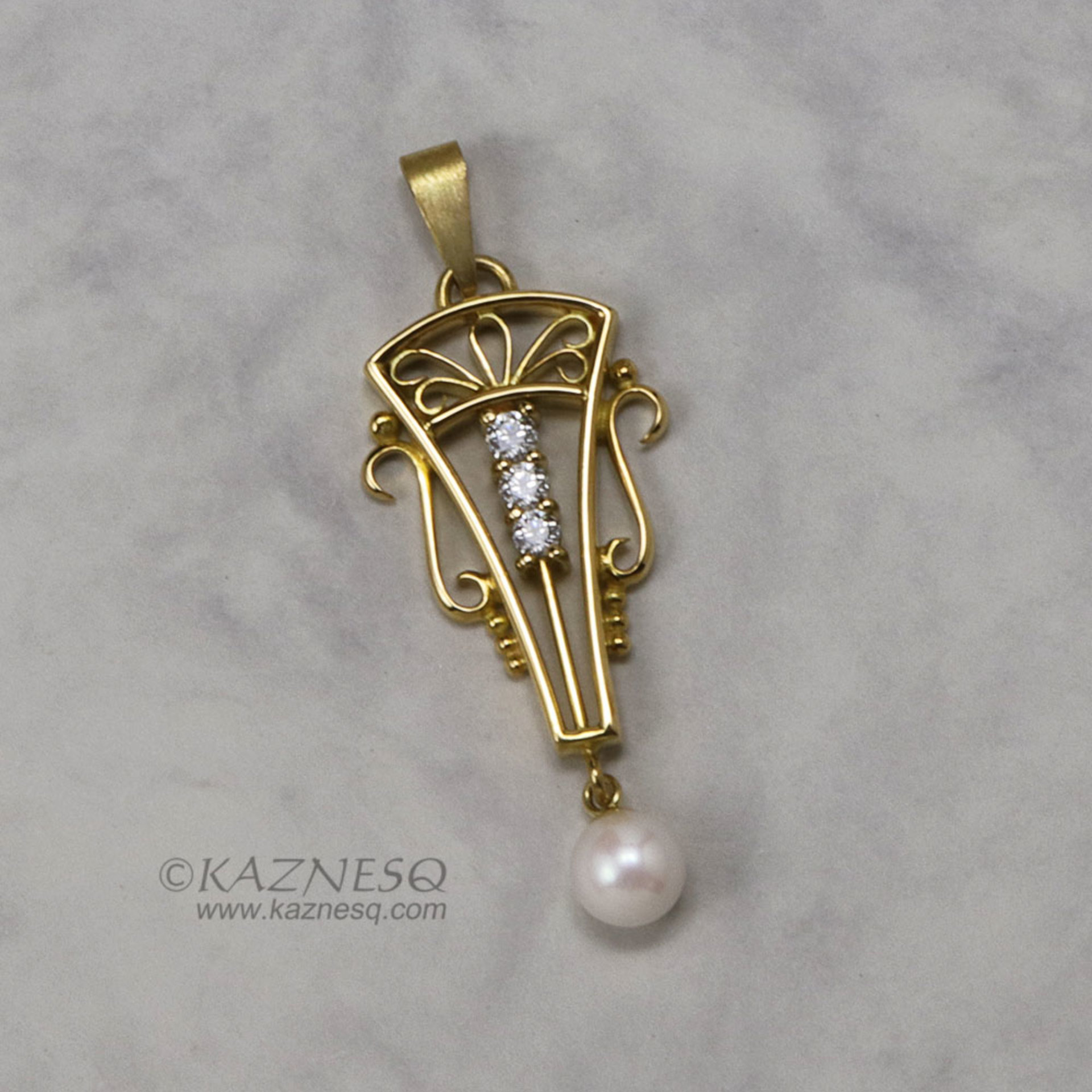 Art Deco style 18K gold, diamond, cultured pearl pendant head of arch motif