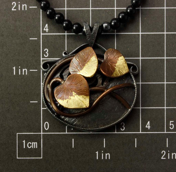 Copper leaf oval pendant
