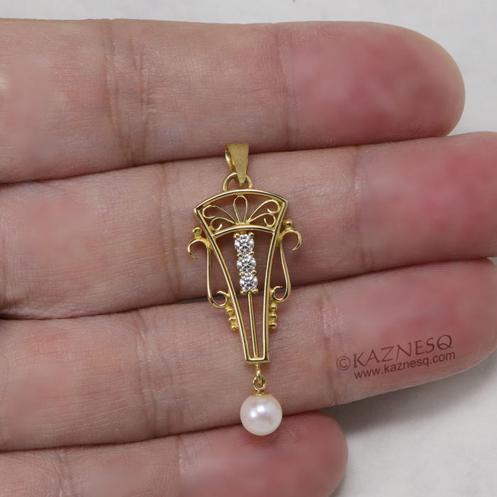 Art Deco style 18K gold, diamond, cultured pearl pendant head of arch motif