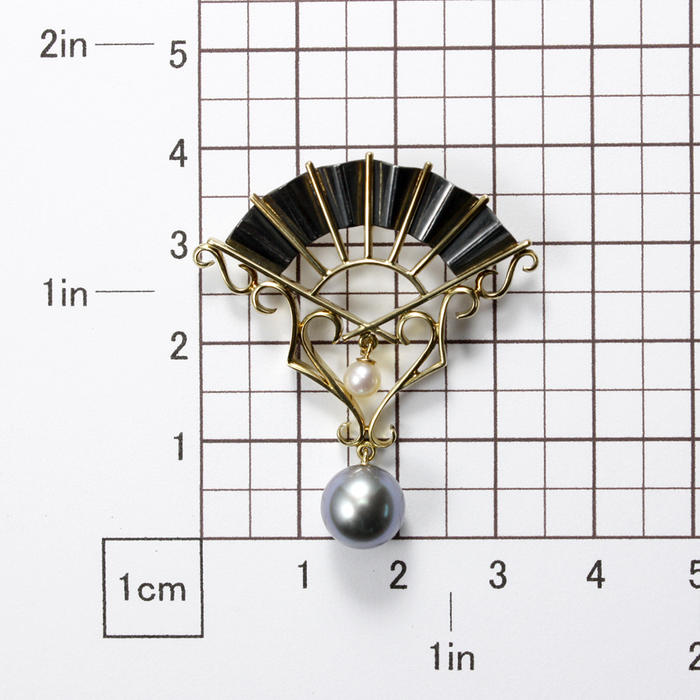 Gold and oxidized silver fan pendant with black and white pearls