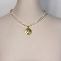 SOLD: Gold silver round pendant with a pearl necklace