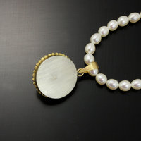 SOLD: Gold silver round pendant with a pearl necklace