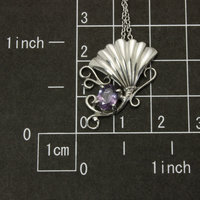 Sold: Purple spinel featured silver pendant of an imaginary flower