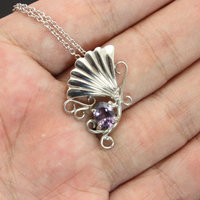 Sold: Purple spinel featured silver pendant of an imaginary flower