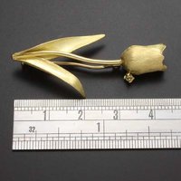 Tulip brooch featuring a diamond