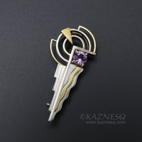 Art Deco style 18K gold and silver combi brooch with a amethyst