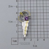 Art Deco style 18K gold and silver combi brooch with a amethyst