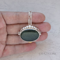 (C) KAZNESQ: Velvet obsidian oval silver pendant with pearls