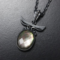Sold: Silver pendant of quartz backed up by black pearl oyster