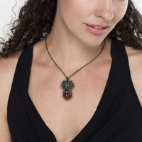 Art Nouveau style tentacles pendant necklace with garnet.