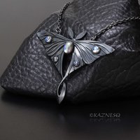 (C) KAZNESQ: Moon moth motif oxidized silver and Royal blue moonstone pendant