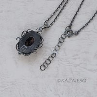 (C) KAZNESQ: Iolite Sunstone oxidized silver filigree and scrolls pendant neckla
