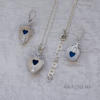 A set of Shattuckite Silver Earrings and a Necklace.