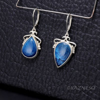 A set of Shattuckite Silver Earrings and a Necklace.