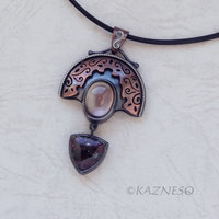 Quartz lined with Black Mother of Pearl Openwork Copper and oxidized silver Arch pendant featuring Eudialyte