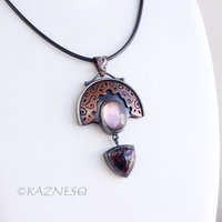 Quartz lined with Black Mother of Pearl Openwork Copper and oxidized silver Arch pendant featuring Eudialyte