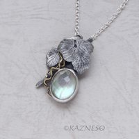 Mystical Brilliance! Silver Leaf Pendant with Rutilated Quartz Backed by Mother of Pearl