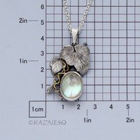 Mystical Brilliance! Silver Leaf Pendant with Rutilated Quartz Backed by Mother of Pearl