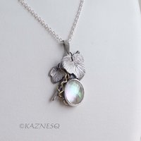 Mystical Brilliance! Silver Leaf Pendant with Rutilated Quartz Backed by Mother of Pearl