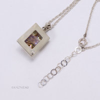 Alluring iridescence! : Rutilated Quartz with Paua Shell Rectangle Silver Pendant