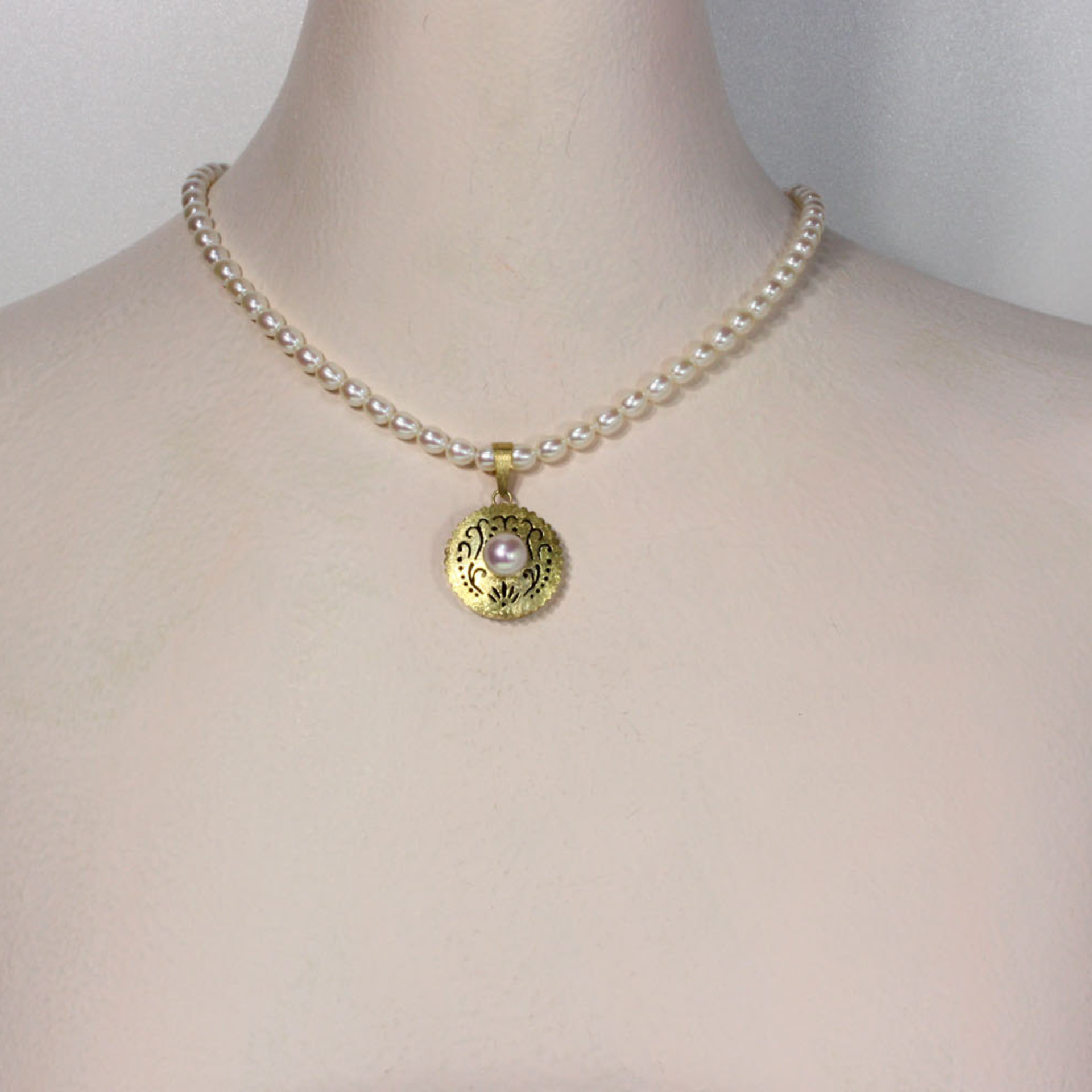 SOLD: Gold silver round pendant with a pearl necklace