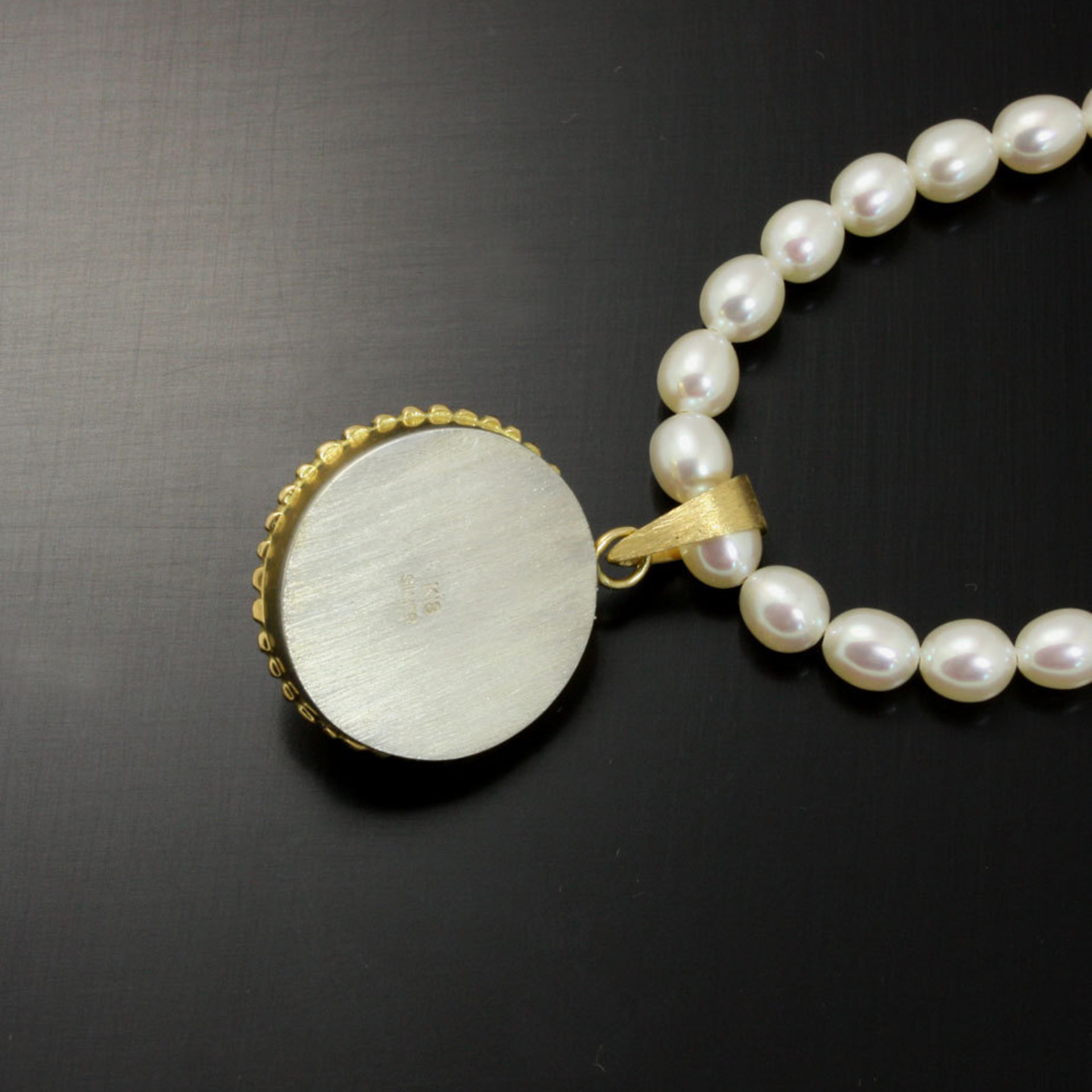 SOLD: Gold silver round pendant with a pearl necklace