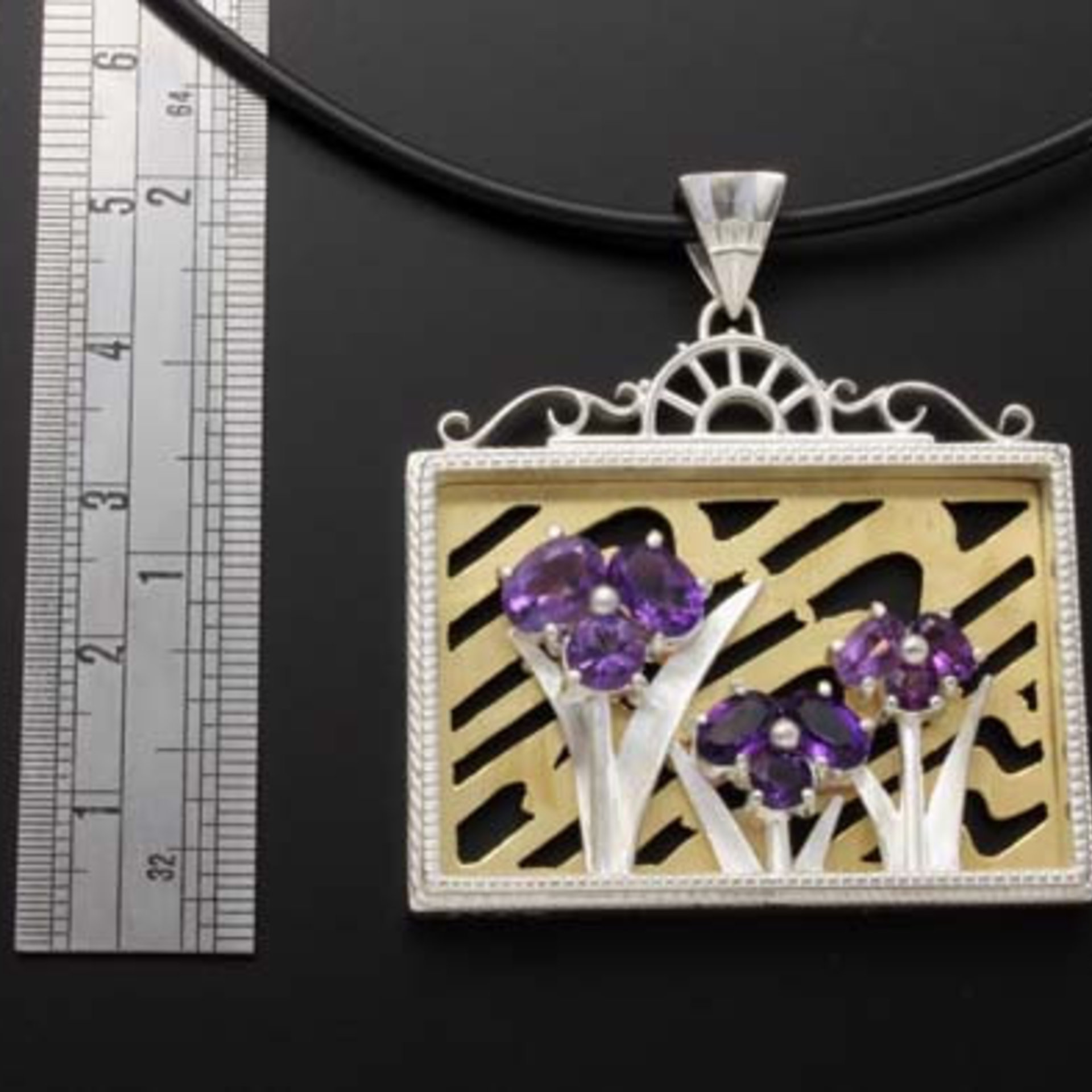 (C) KAZNESQ: Iris pendant featuring amethyst