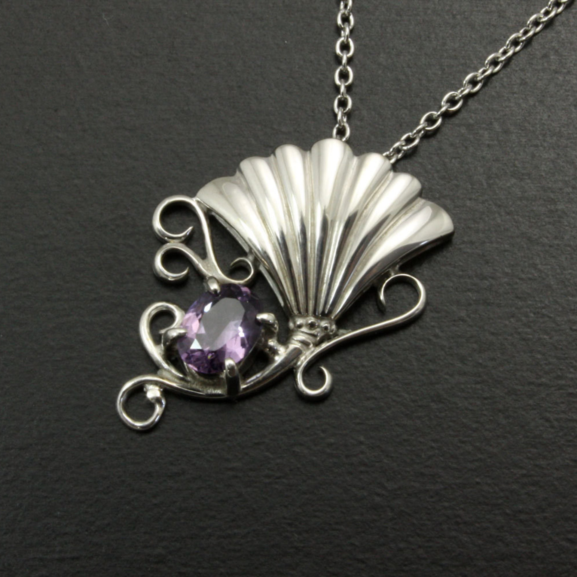 Sold: Purple spinel featured silver pendant of an imaginary flower
