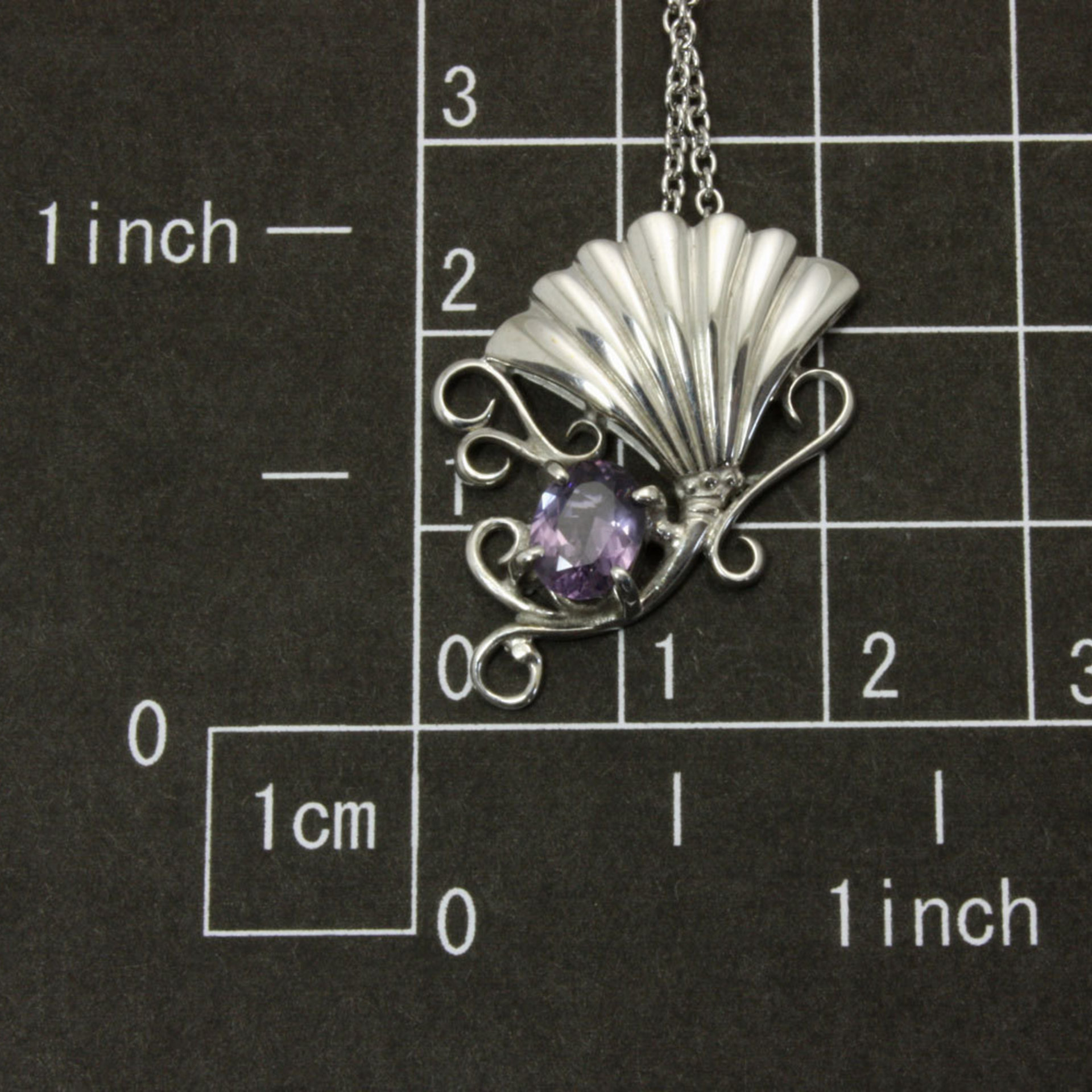 Sold: Purple spinel featured silver pendant of an imaginary flower