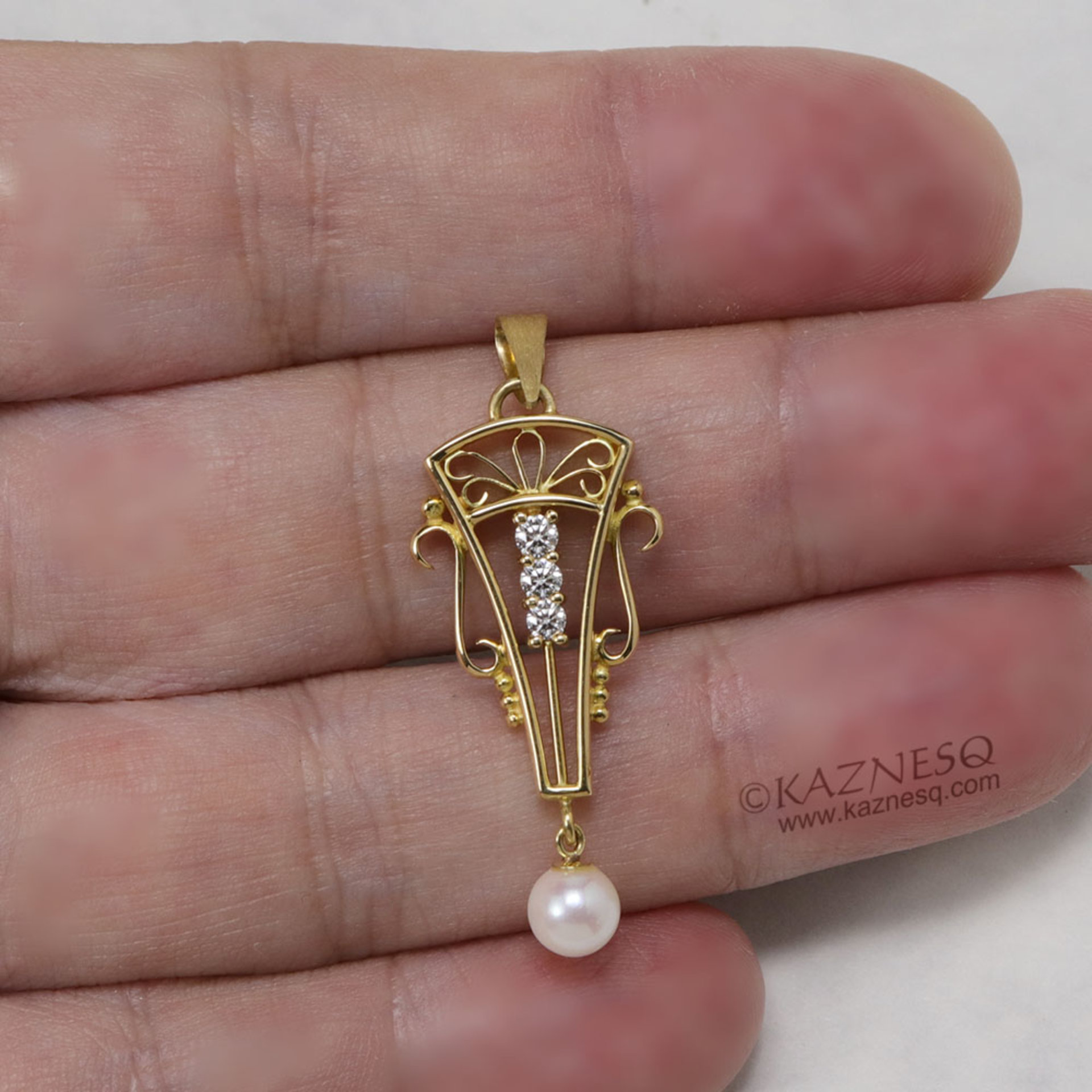 Art Deco style 18K gold, diamond, cultured pearl pendant head of arch motif