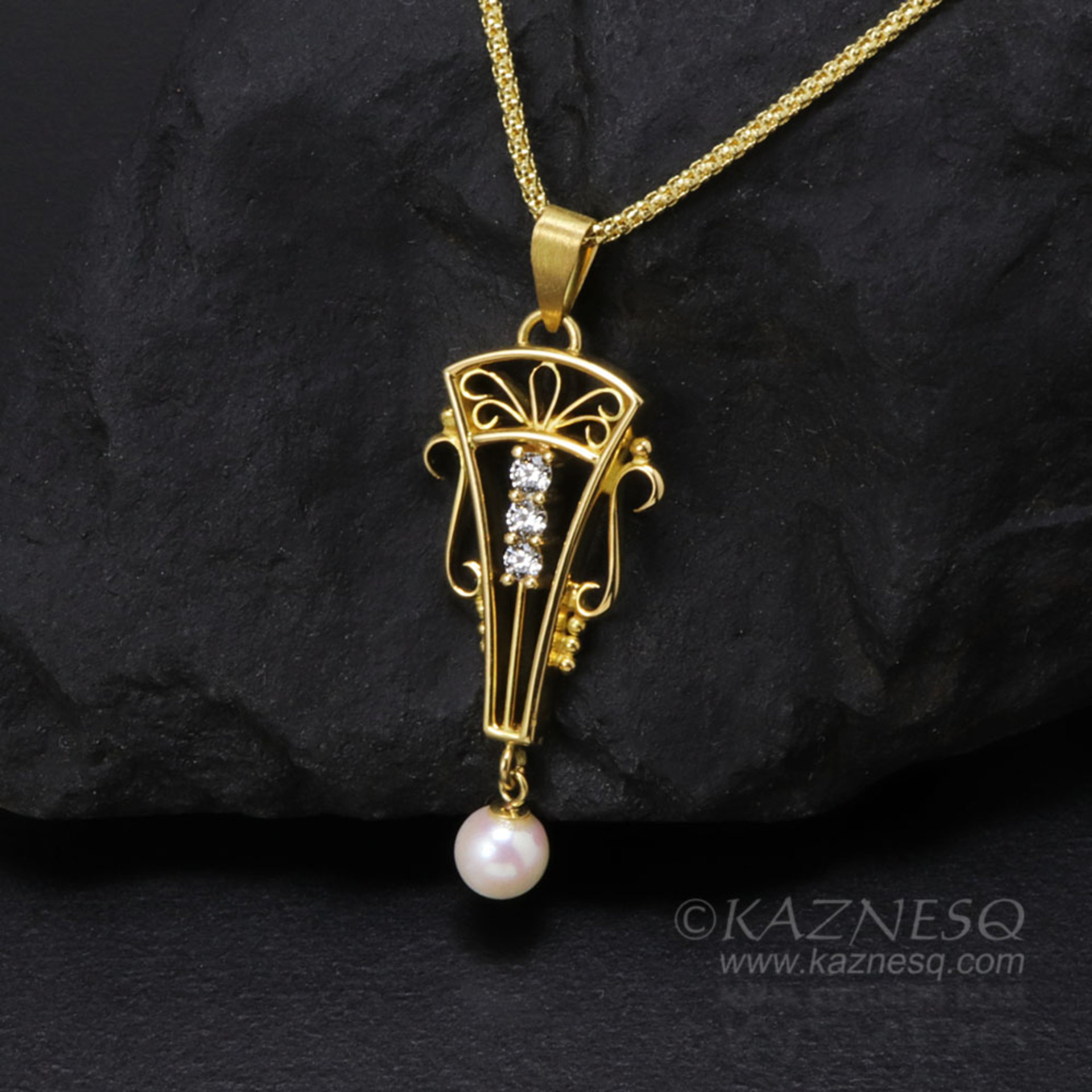 Art Deco style 18K gold, diamond, cultured pearl pendant head of arch motif