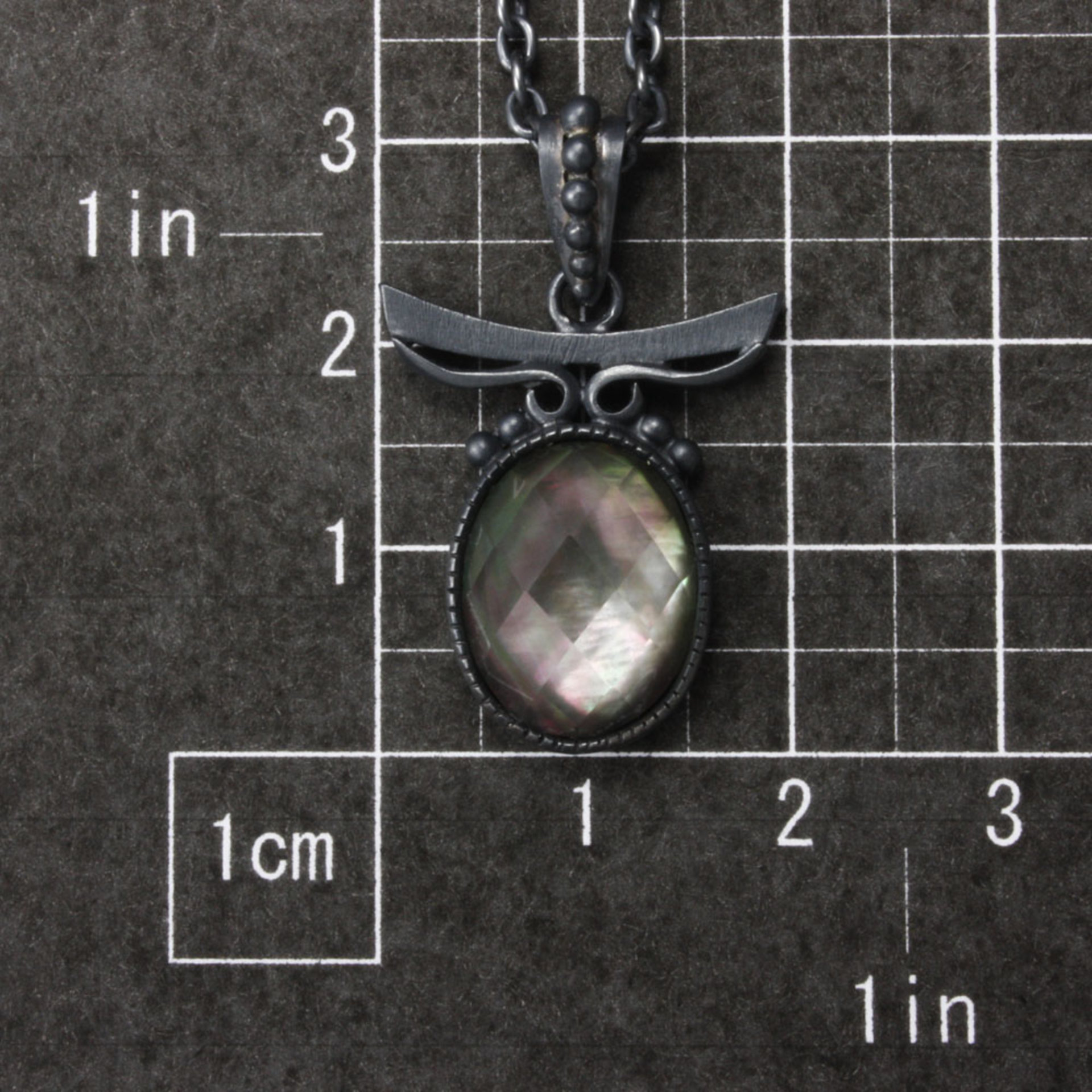 Sold: Silver pendant of quartz backed up by black pearl oyster
