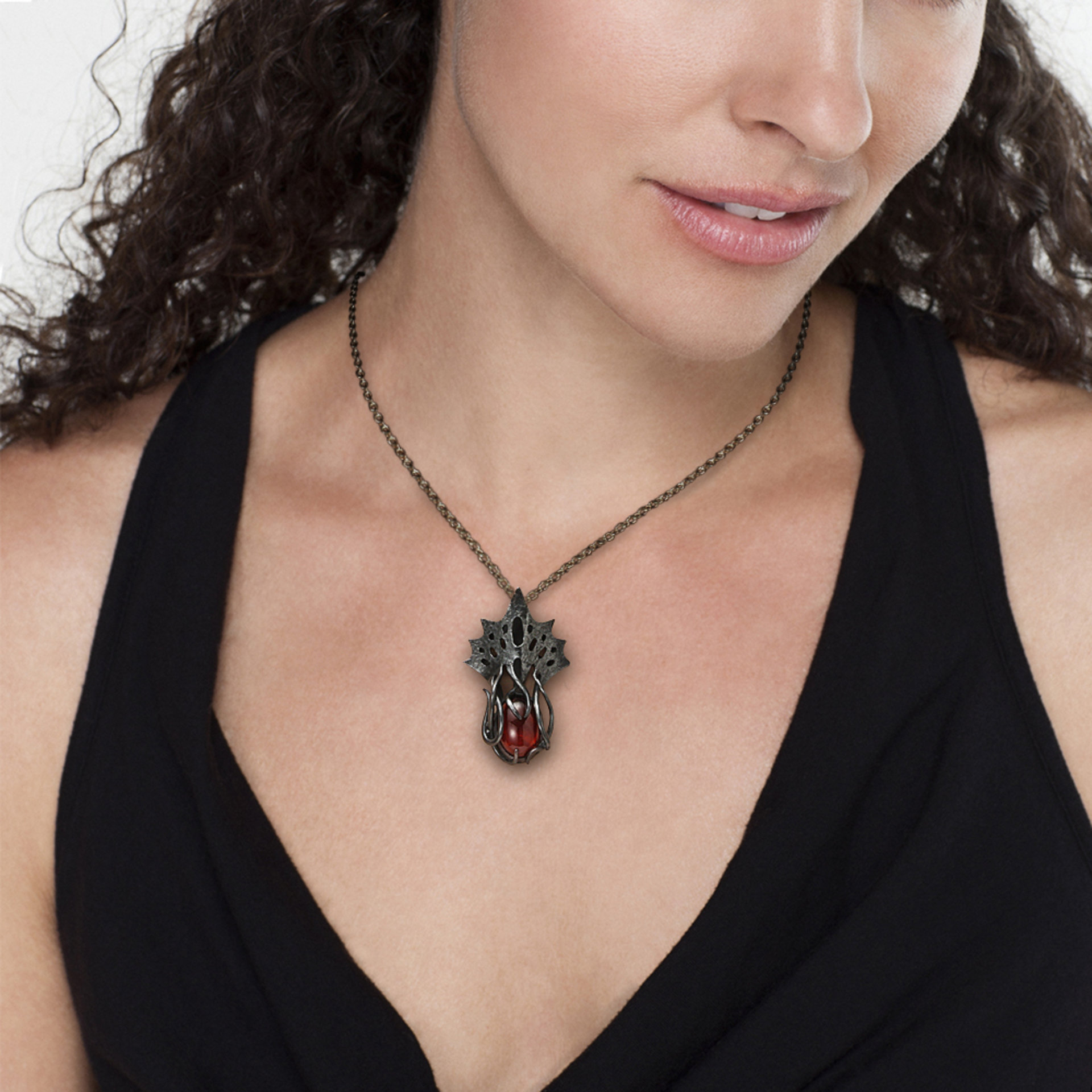 Art Nouveau style tentacles pendant necklace with garnet.