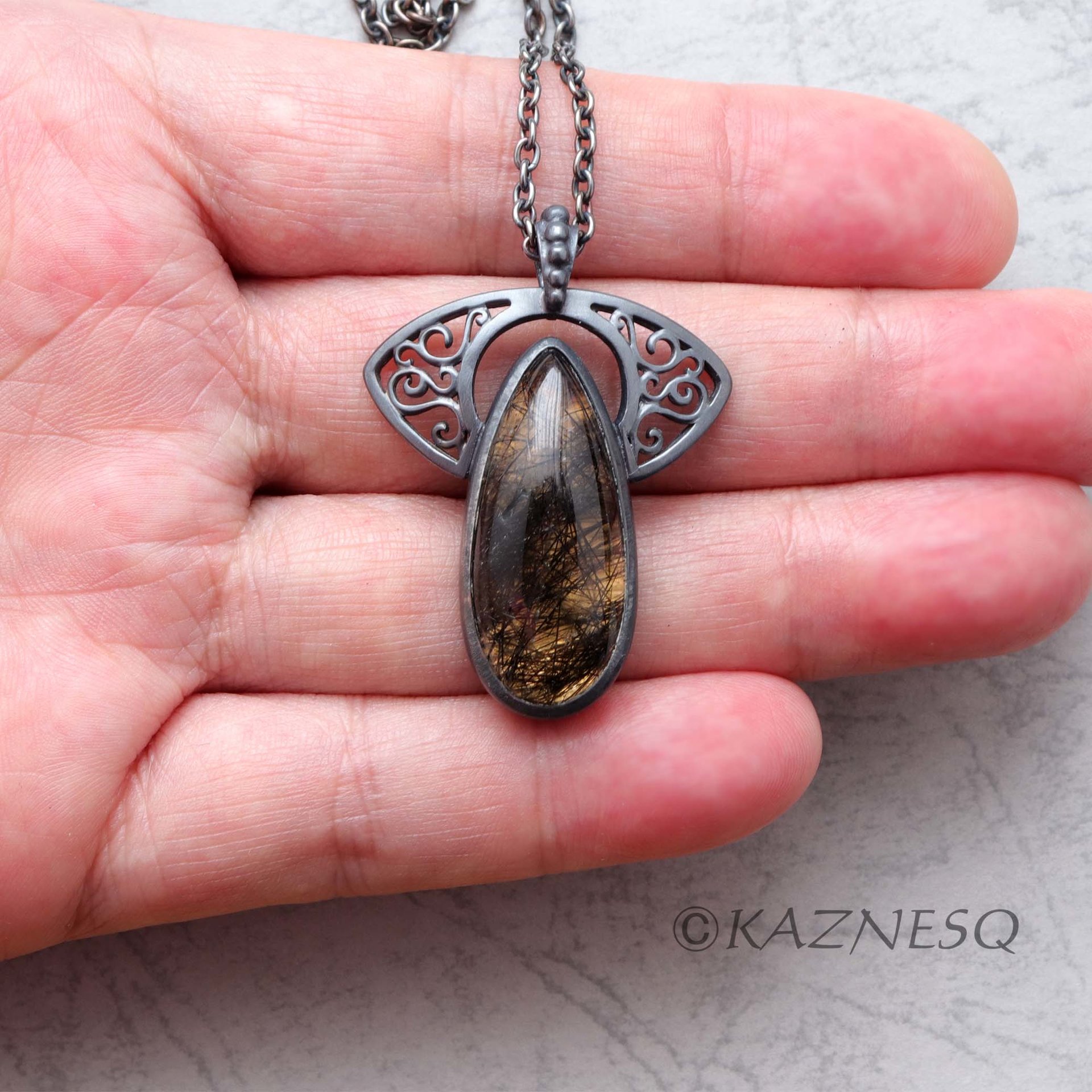(C)KAZNESQ: Black tourmaline quartz lined with gold oxidized silver necklace