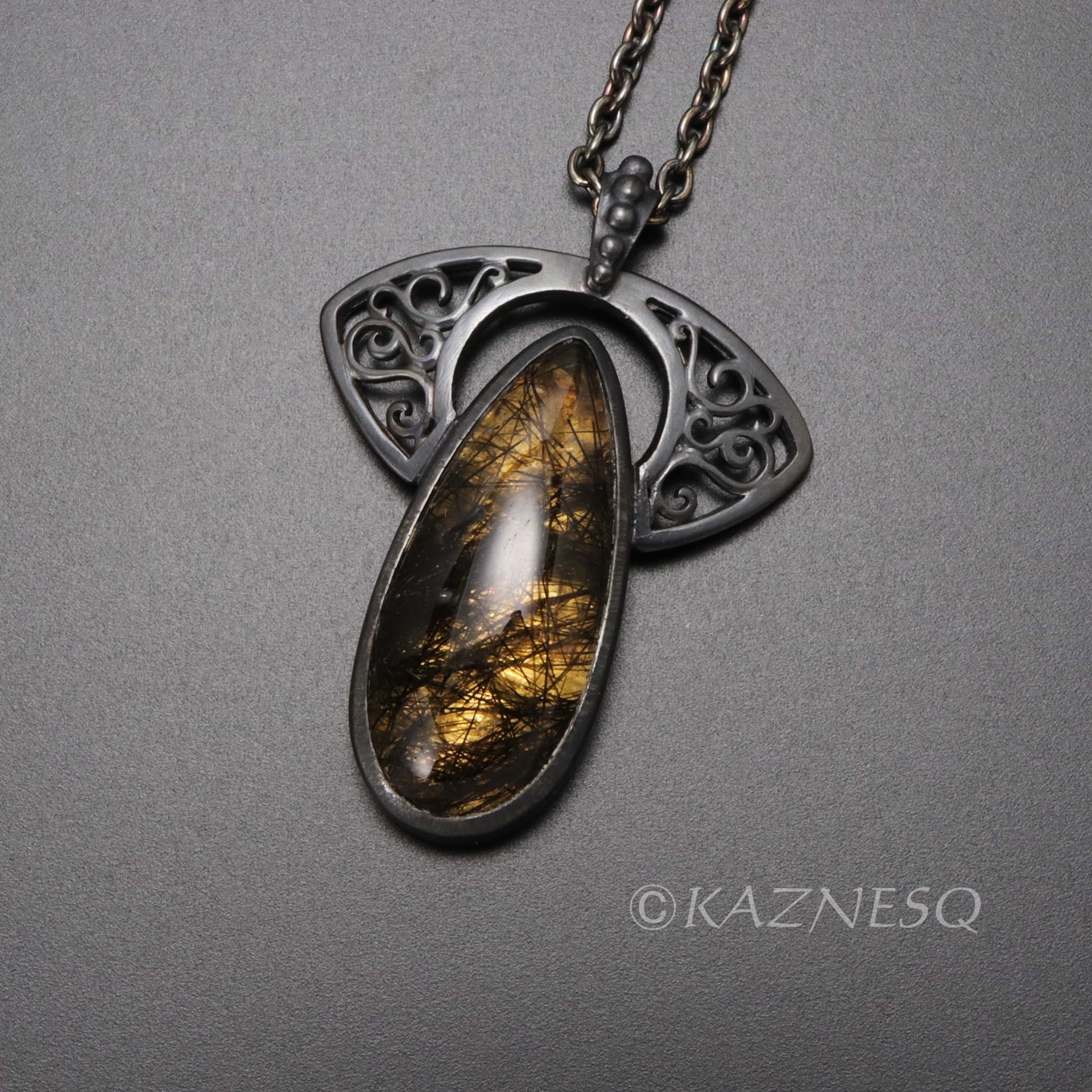 (C)KAZNESQ: Black tourmaline quartz lined with gold oxidized silver necklace
