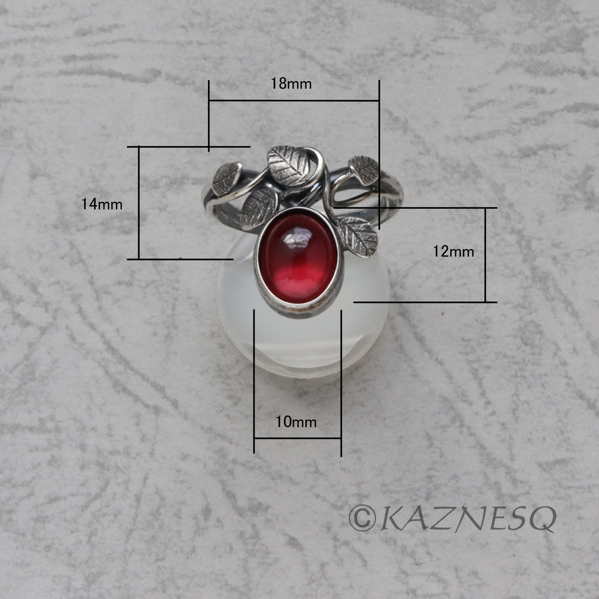 SOLD: Oval garnet cab lined with mother of pearl Art Nouveau style leaf ring of oxidized silver
