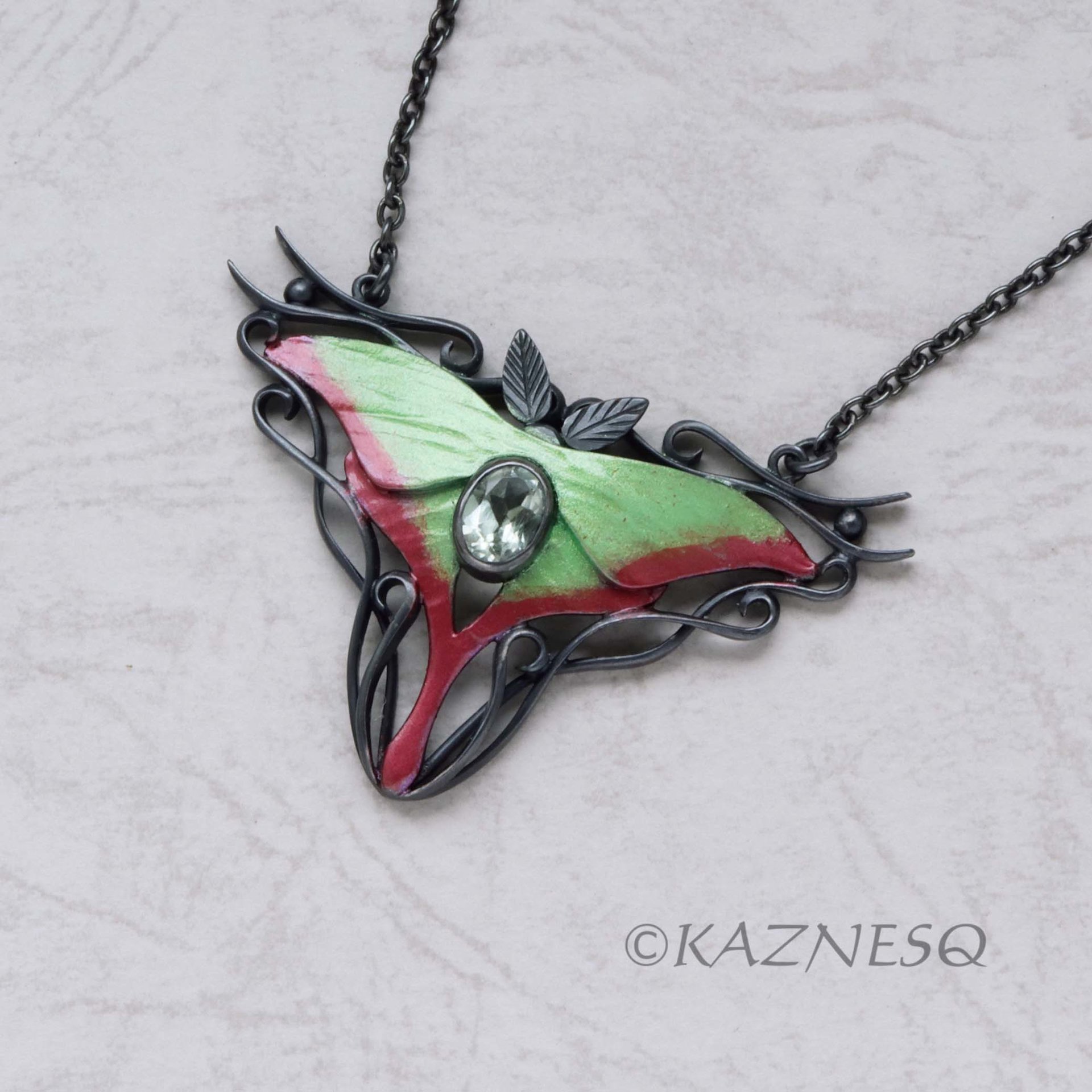 (C) KAZNESQ: Moon Moth colored silver pendant necklace with green quartz.