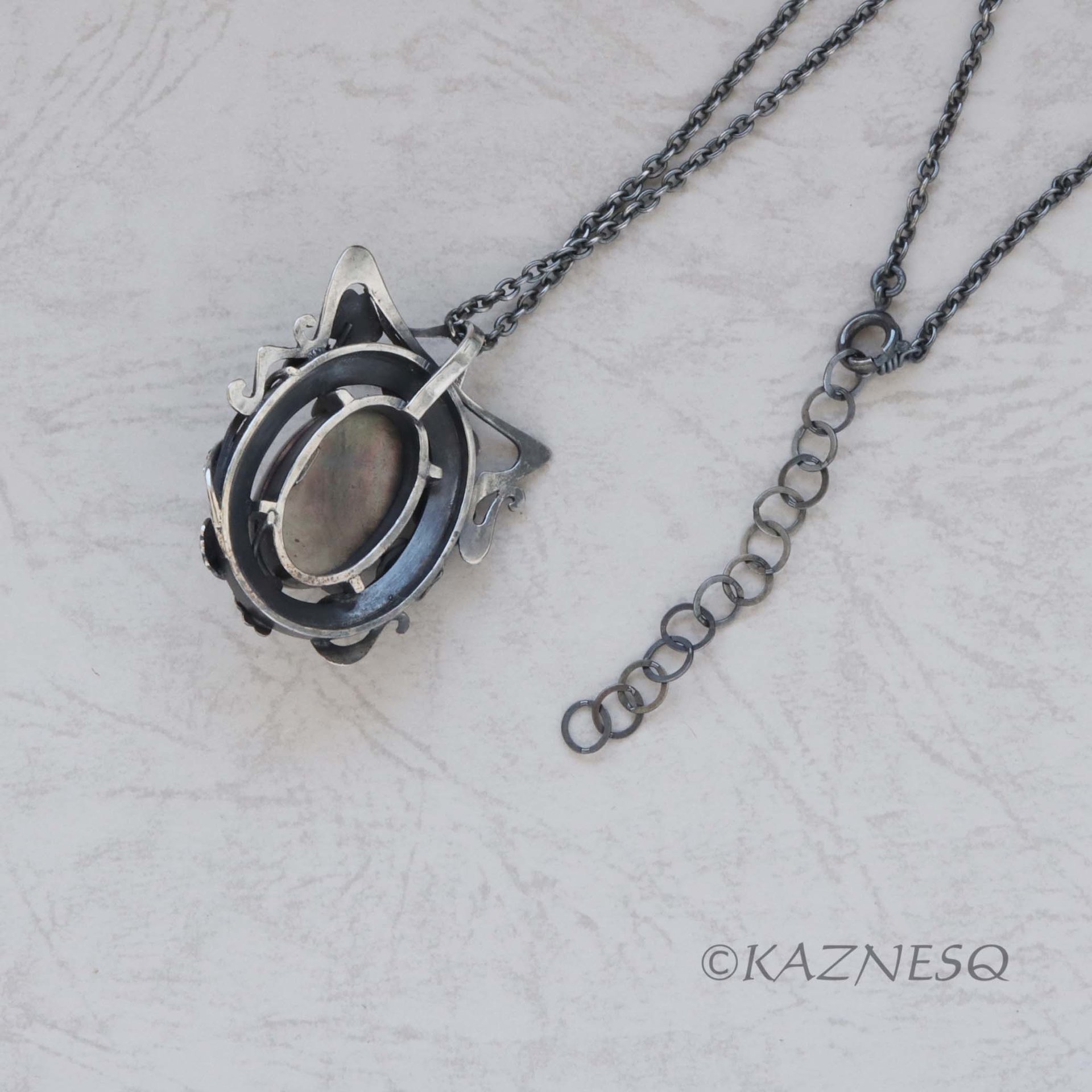 (C) KAZNESQ: Rutilated Quartz with Mother of Pearl Oxidized Silver decorated Fra