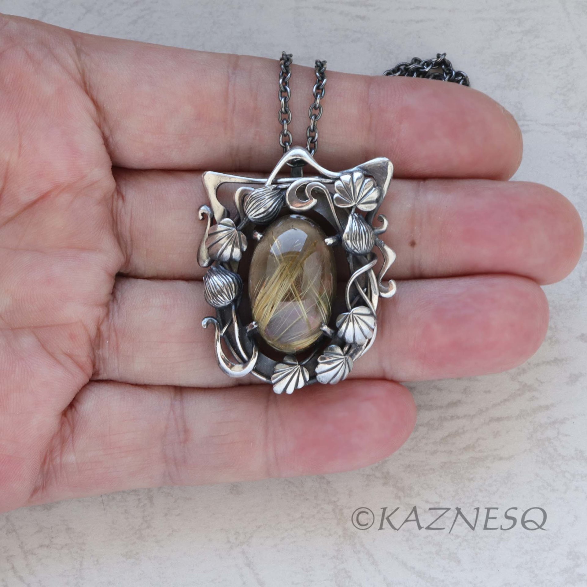 (C) KAZNESQ: Rutilated Quartz with Mother of Pearl Oxidized Silver decorated Fra