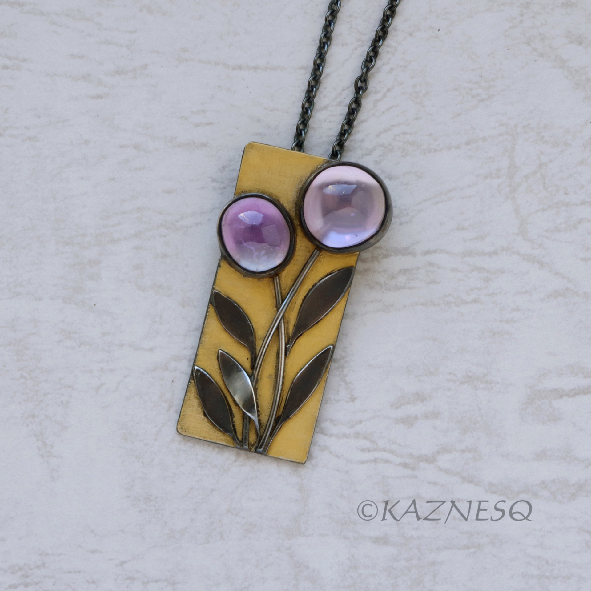 (C) KAZNESQ: Amethyst lined with Mother of Pearl Rectangle Gold tone Oxidized Si