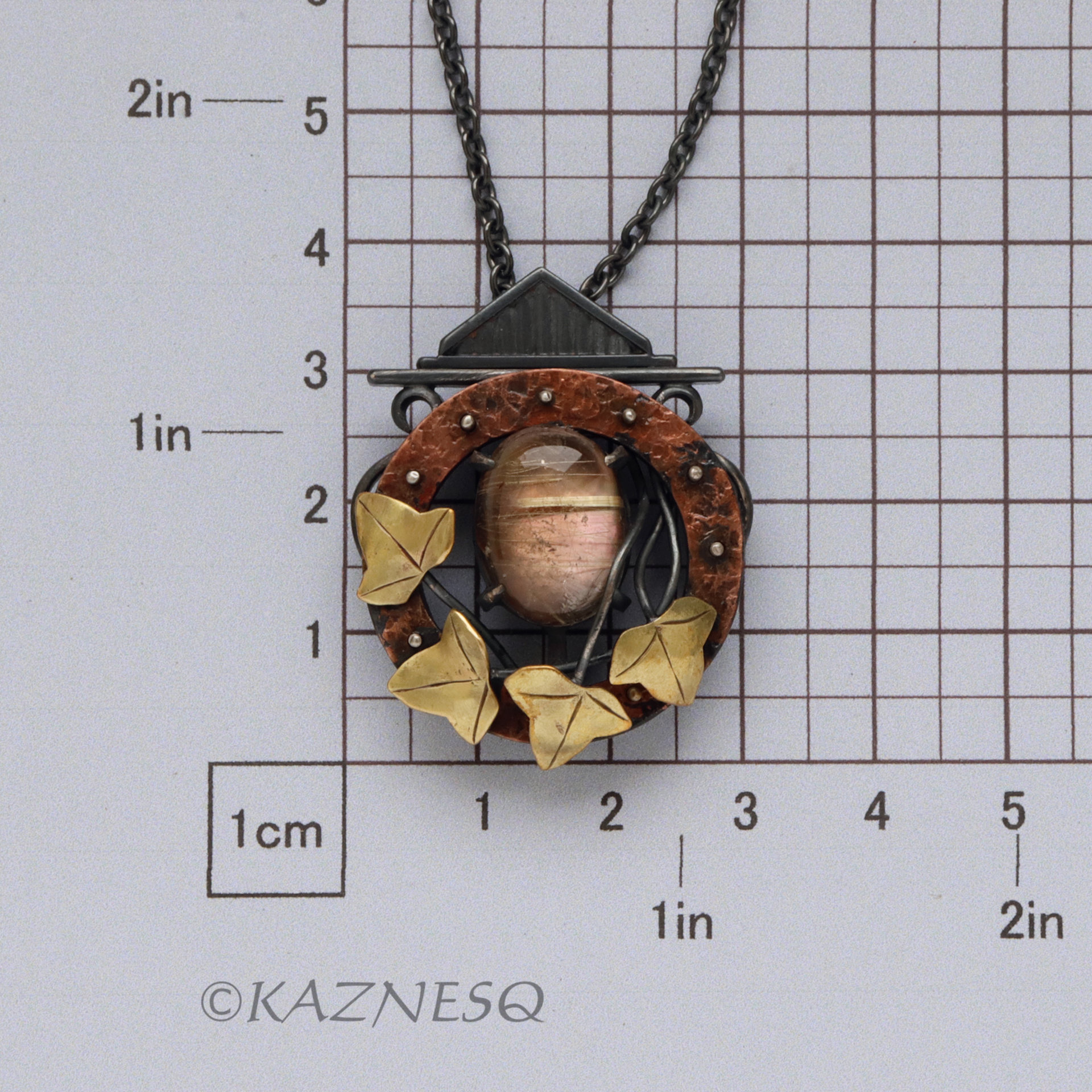 (C) KAZNESQ: Rutilated quartz and Mother of pearl round copper clock, brass leav