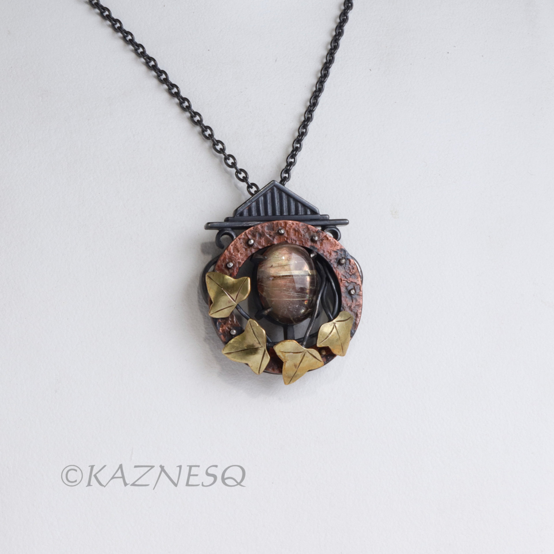 (C) KAZNESQ: Rutilated quartz and Mother of pearl round copper clock, brass leav