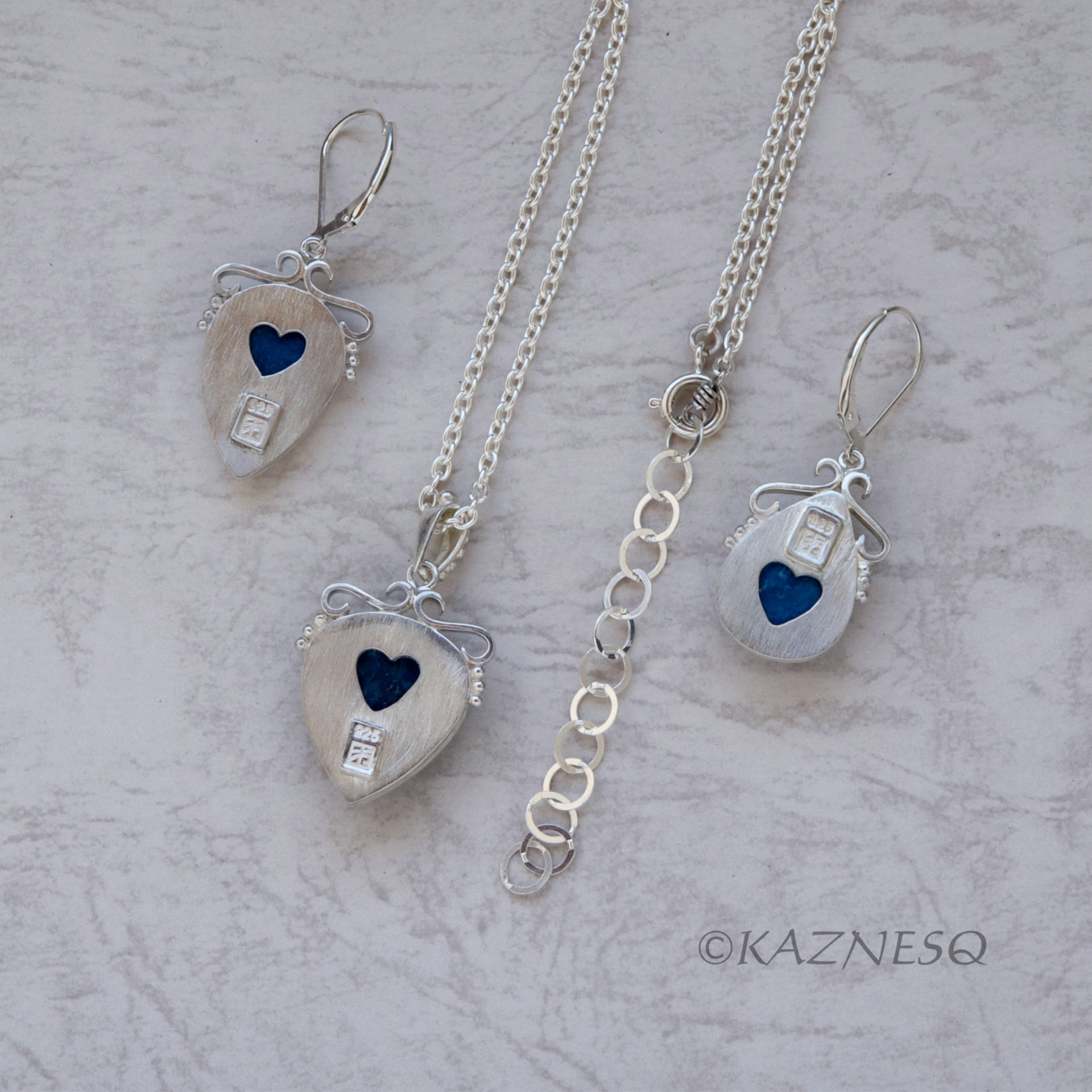 A set of Shattuckite Silver Earrings and a Necklace.