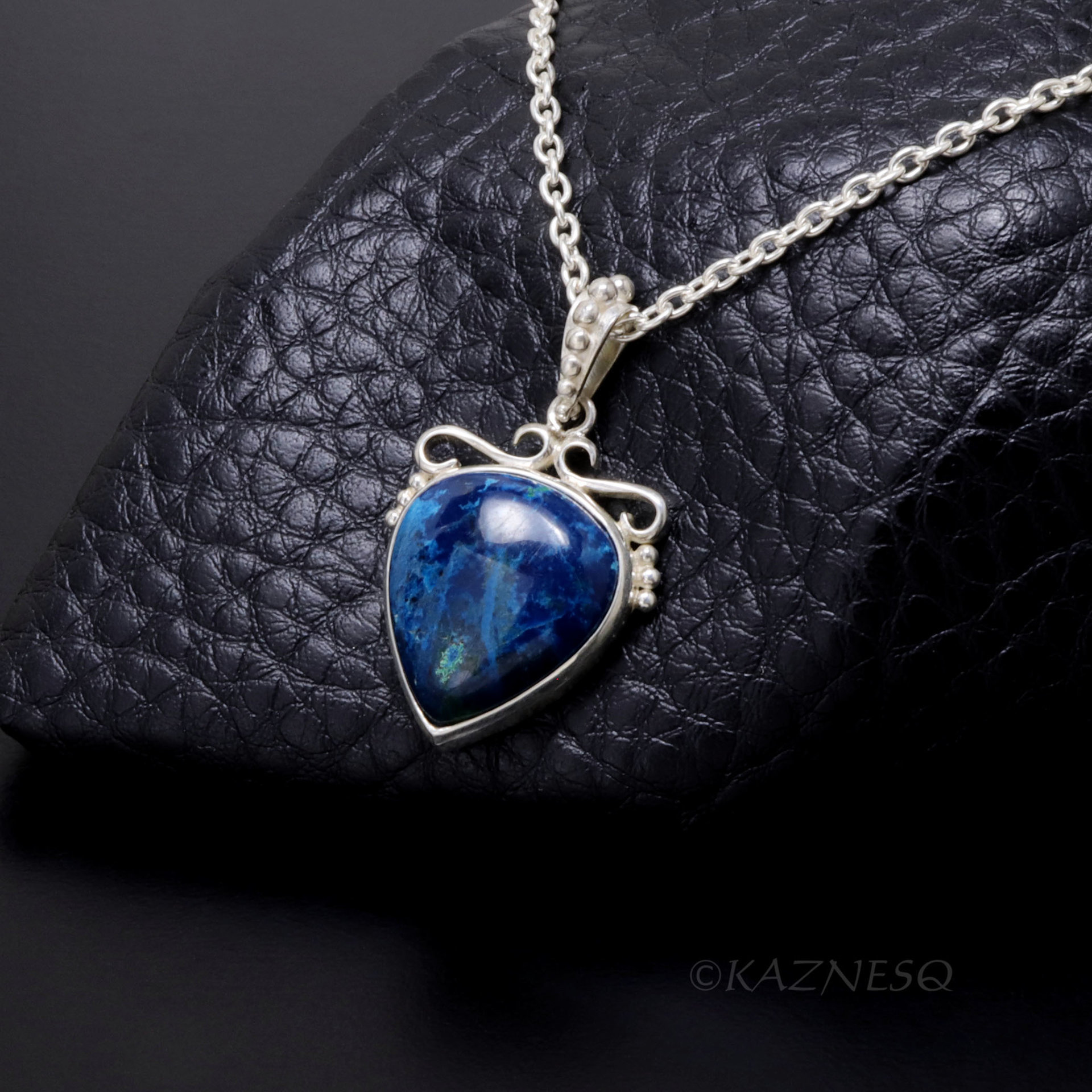 A set of Shattuckite Silver Earrings and a Necklace.