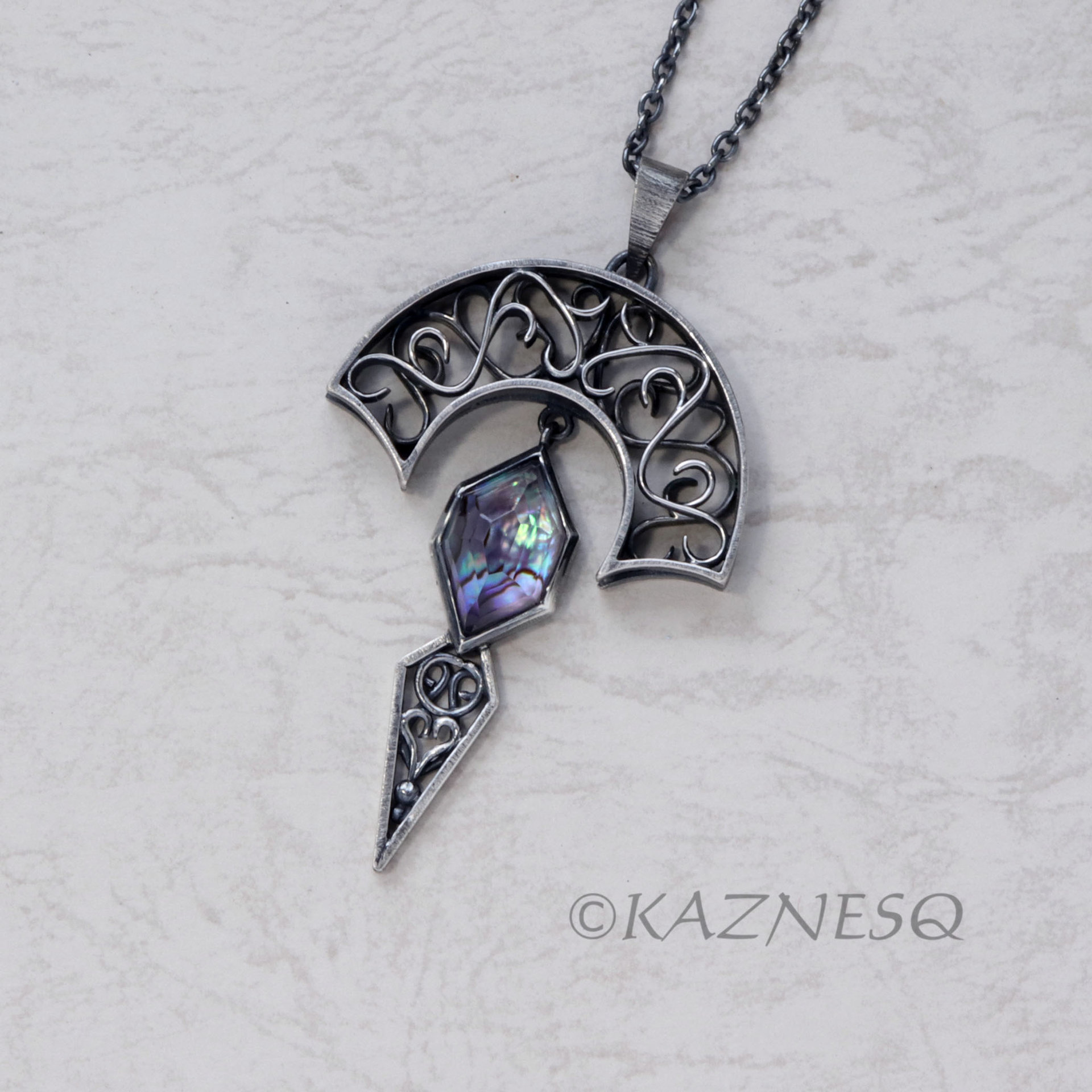 Art Nouveau style Arch pendant necklace with amethyst lined with Paua shell