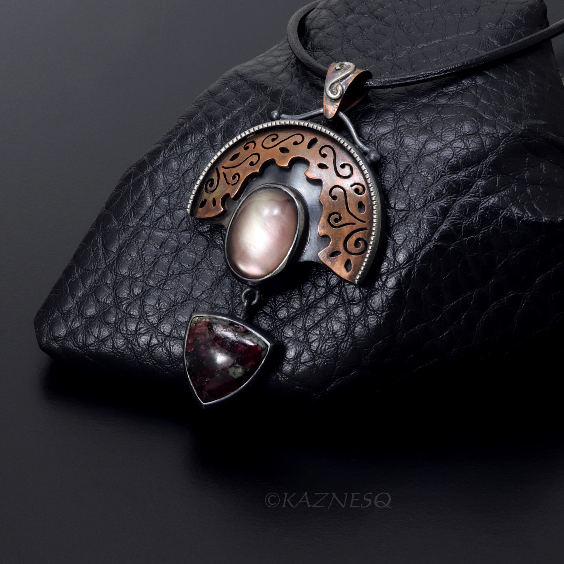 Quartz lined with Black Mother of Pearl Openwork Copper and oxidized silver Arch pendant featuring Eudialyte