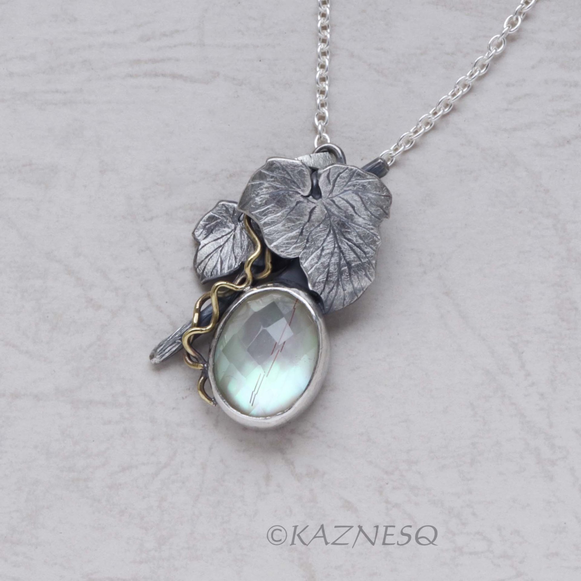 Mystical Brilliance! Silver Leaf Pendant with Rutilated Quartz Backed by Mother of Pearl