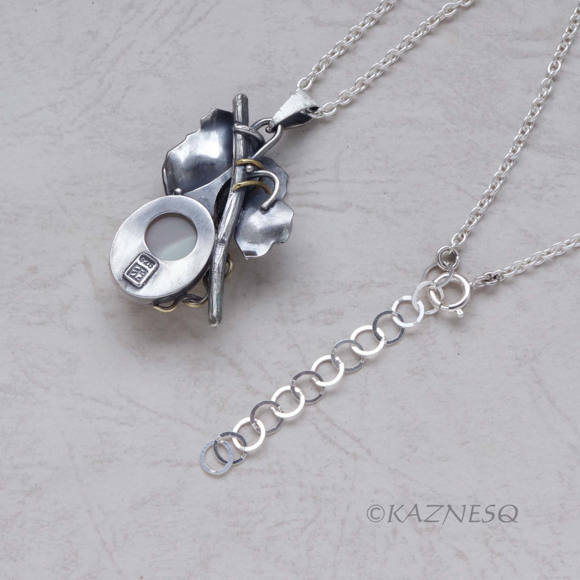 Mystical Brilliance! Silver Leaf Pendant with Rutilated Quartz Backed by Mother of Pearl