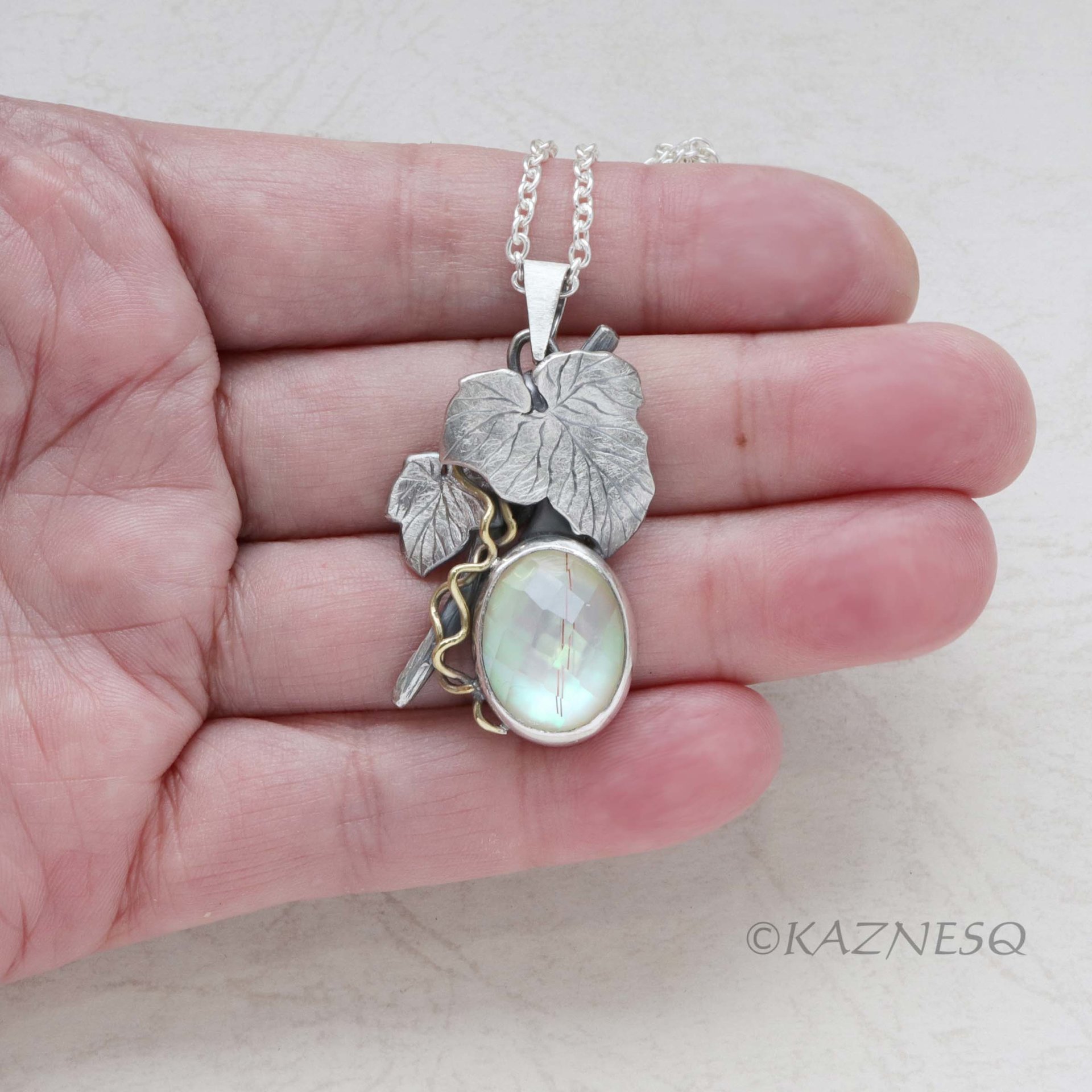 Mystical Brilliance! Silver Leaf Pendant with Rutilated Quartz Backed by Mother of Pearl